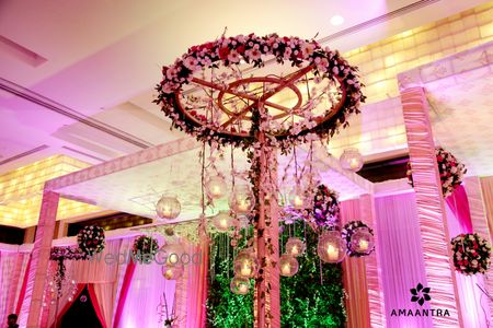 Hanging floral arrangement with candle stands