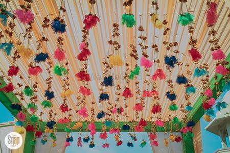 Photo of Hanging tassels for mehendi decor from tent