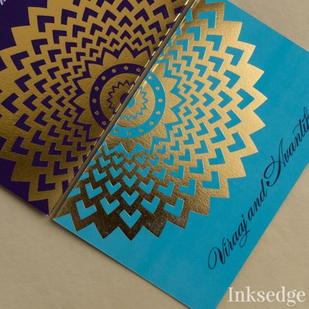 Photo of Blue wedding card with gold foil print