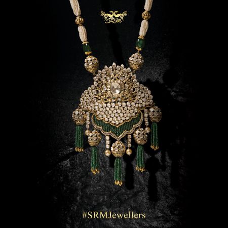 Polki unique gold necklace pendant with emerald stones