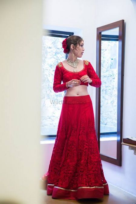 Photo of red threadwork bridal lehenga with detailing
