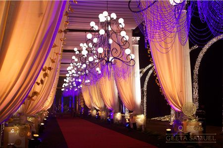 Gold and Purple Drapes with Chandeliers Entrance Decor