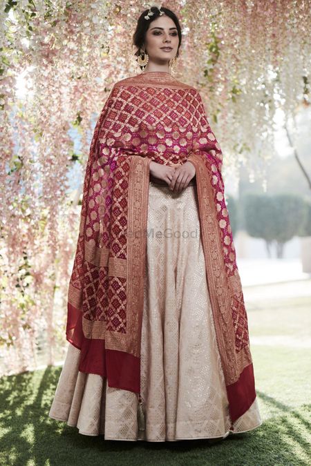 A timeless Benarasi dupatta and off white suit combo for engagement