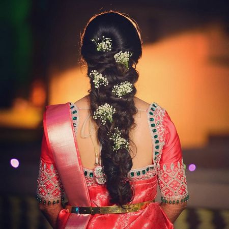 South Indian bridal braid pinned with baby's breaths
