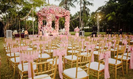 Gorgeous pink decor with a floral mandap