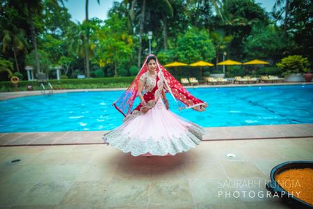 Photo of Baby Pink and Red Twirling Lehenga