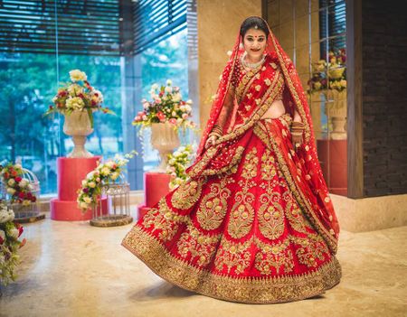 Photo of Red zardozi bridal lehenga by Sabyasachi