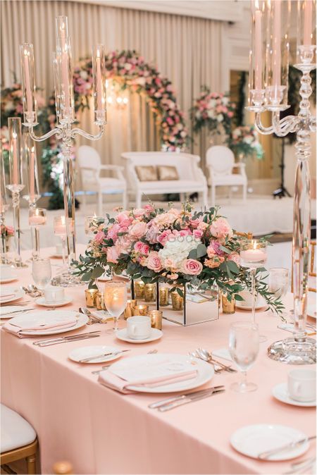 An elegant table setting decor with flowers and candles