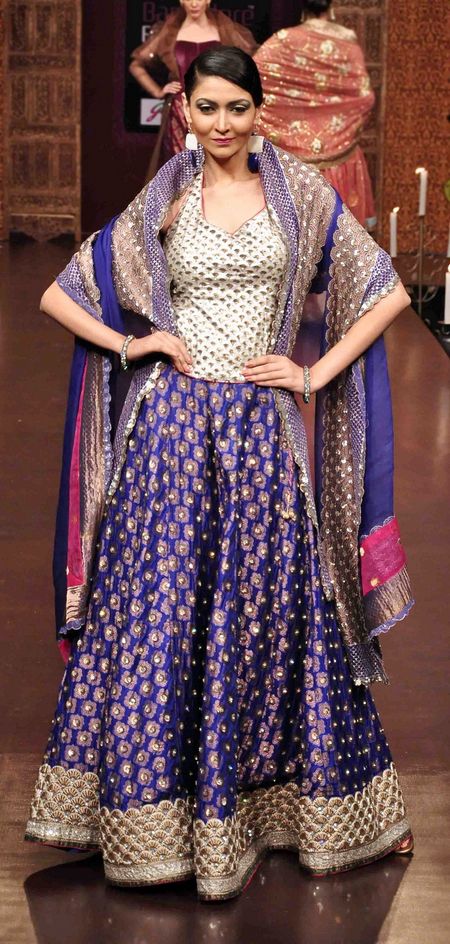 Navy blue all over embroidered lehenga with sleeveless corset style blouse and blue dupatta