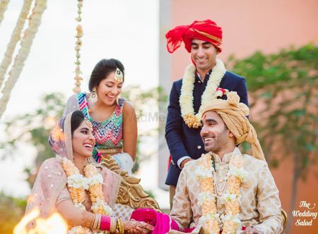 Photo of cute and happy couple shot during the jaimala