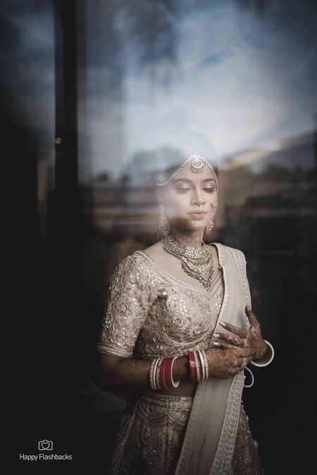 Photo of Bridal portrait by the window