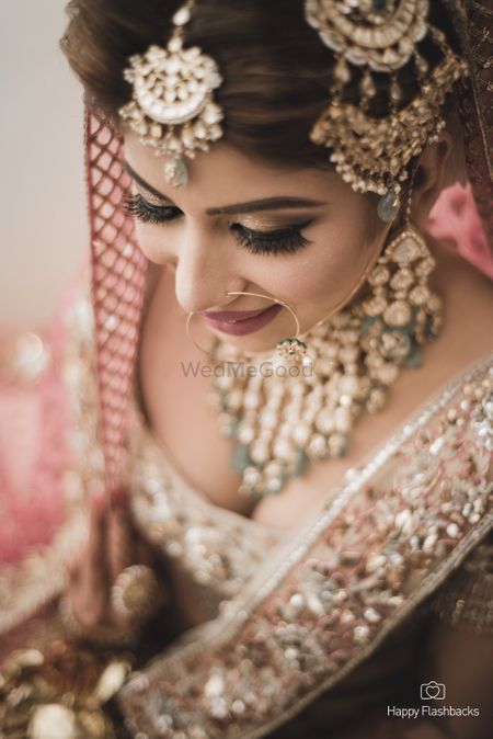 Photo of Top angle bridal portrait wearing loads of jewellery
