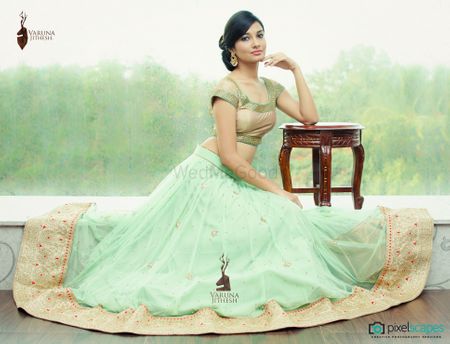 mint georgette lehenga with border and gold metallic short sleeved blouse