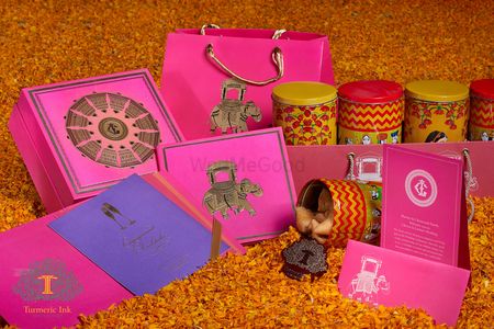 Pink and yellow cards and boxes with elephant motifs
