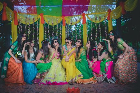 Bride with bridesmaids on mehendi day