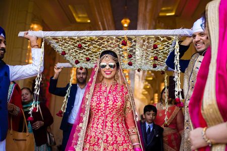 Cool bride under chadar wearing glasses