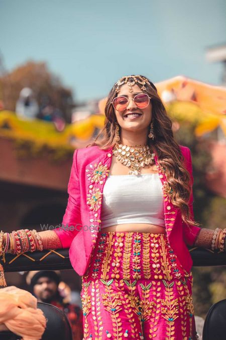 funky mehendi outfit in bright pink with applique work