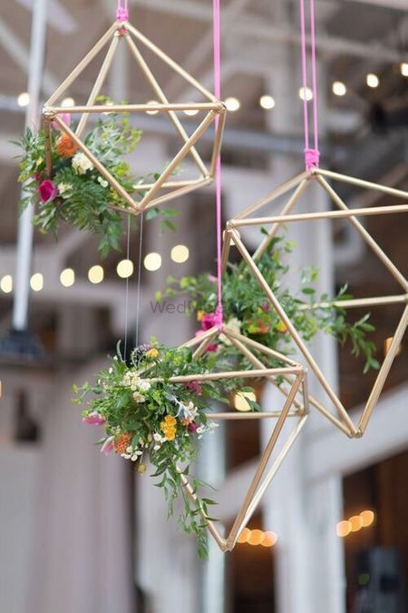 Hanging floral arrangement with wooden sticks