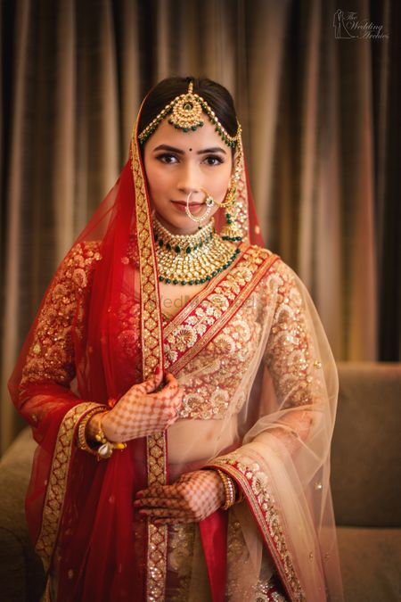 A bride in red with double dupatta