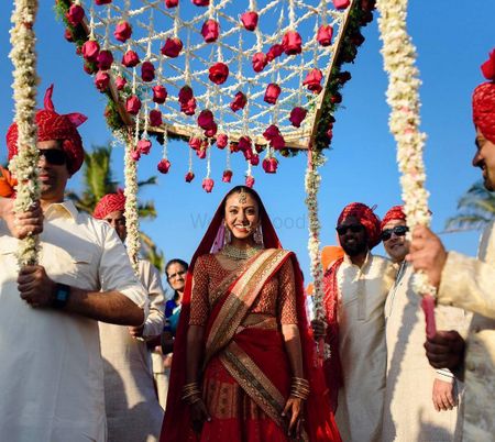 bride entering under phoolon ki chadar