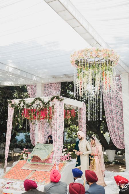 Photo of Mandap with floral drapes