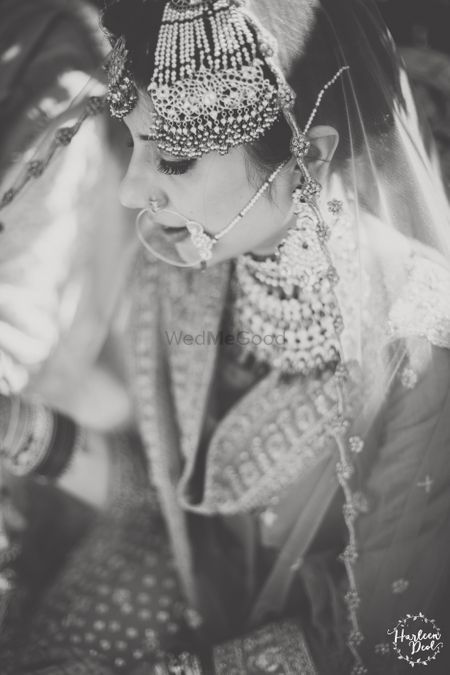 Black and white bridal portrait bride wearing jhoomer 