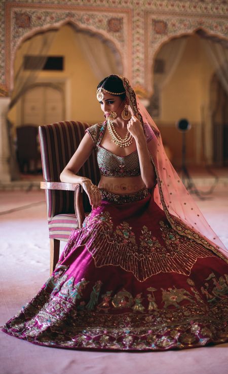Photo of Wine coloured bridal lehenga with unique Baraat embroidery