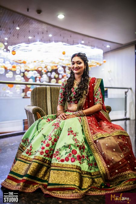 Floral print lehenga in subtle green and bold  red