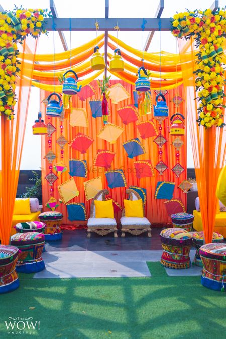 Colourful mehndi decor idea with kites in photobooth