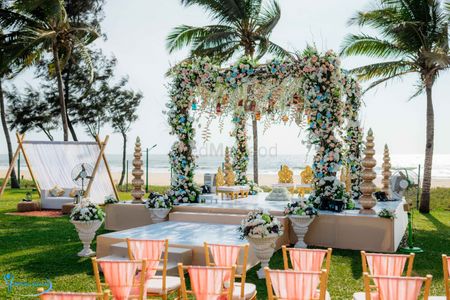 Beachside floral mandap for an outdoor wedding.