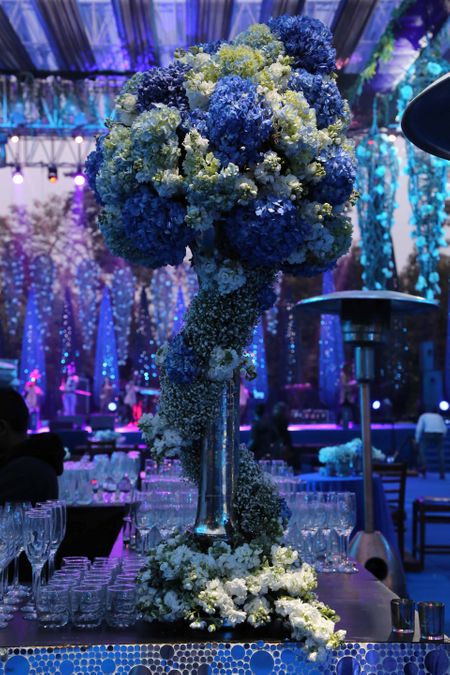 Photo of Blue and white floral table centerpieces