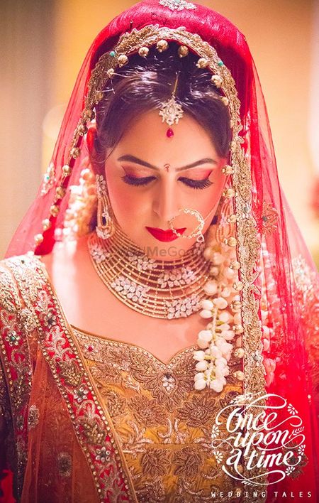 Bride Wearing Red Dupatta and Diamond Jewelry