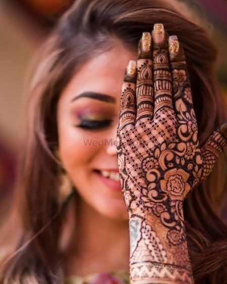 Intricate mehndi design for back of the hands