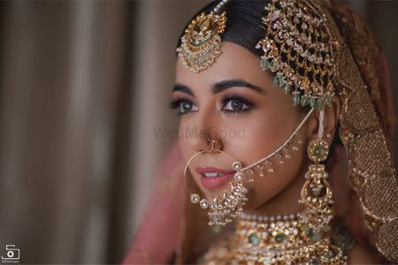 Shot of a bride wearing gorgeous statement jewellery at her wedding