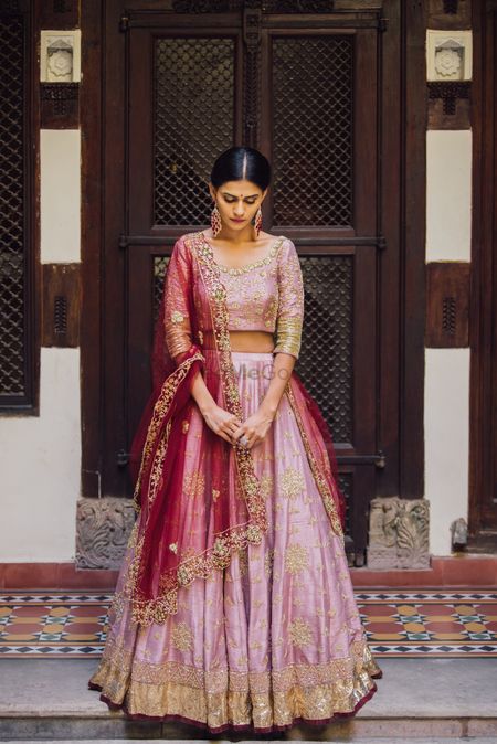 Light pink lehenga with red dupatta for sister of the bride