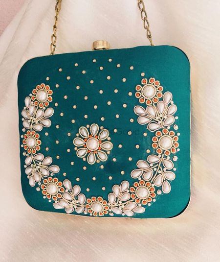 Photo of teal sling clutch
