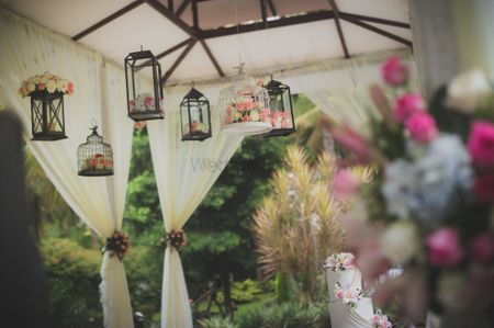 Photo of Hanging lamps with florals in day decor