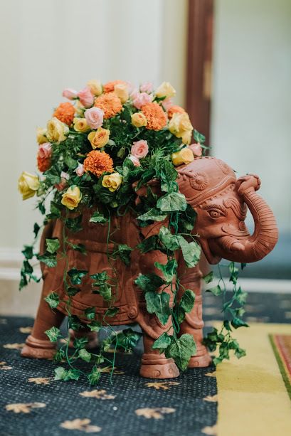 Cute elephant used as a prop with floral arrangements