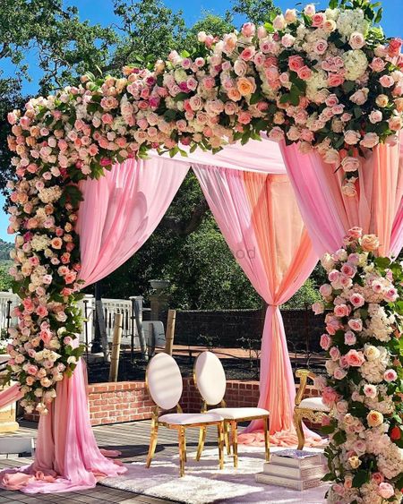 Floral mandap with pink drapes