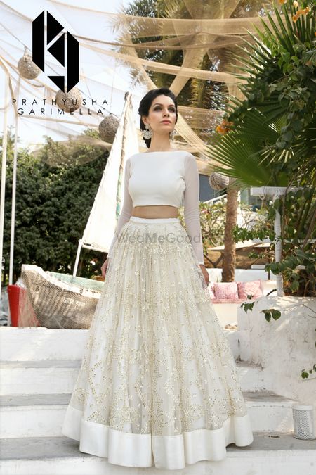 Photo of White and gold light lehenga for sister of the bride