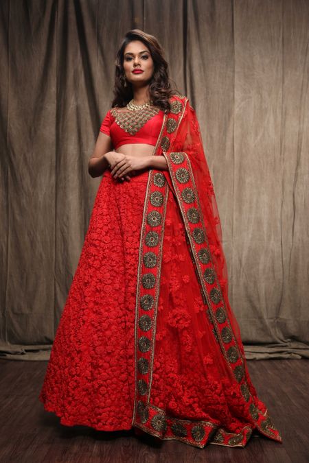 Photo of red threadwork lehengas