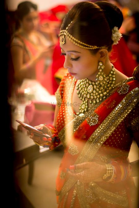Photo of red and gold bridal saaree