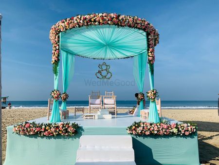 Beachside mandap in turquoise, pink and white hues.