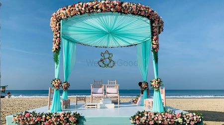 Photo of Beachside mandap in turquoise, pink and white hues.