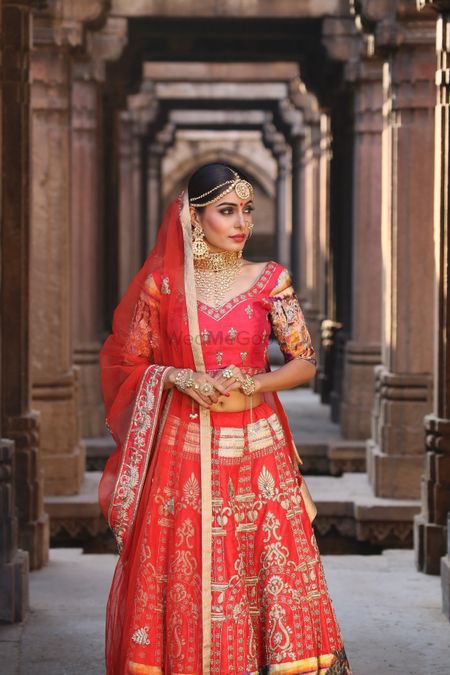 Photo of Red bridal lehenga with peach sleeves