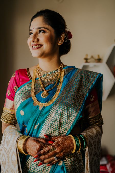 A Maharashtrian bride posing on her wedding day.