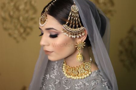 Photo of Bride with soft smokey makeup and jhoomer
