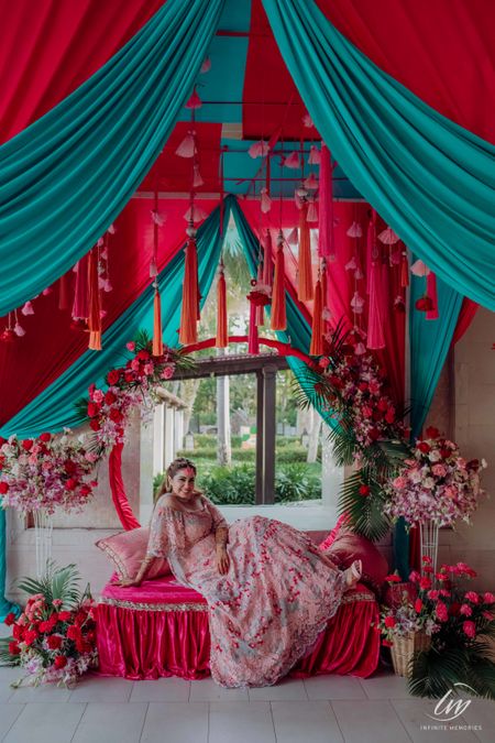 Photo of mehendi decor idea and bride with tassels