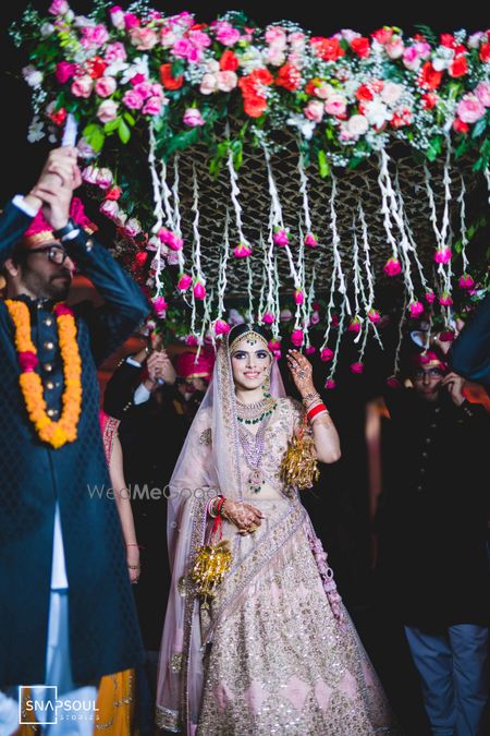 Bridal entry in lavender lehenga and phoolon ka chadar 