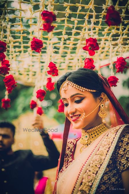 Bridal portrait under phoolon ka chadar with roses 